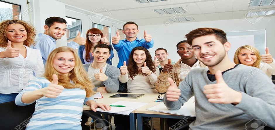 18551415-Many-happy-students-with-teacher-holding-their-thumbs-up-in-university-Stock-Photo