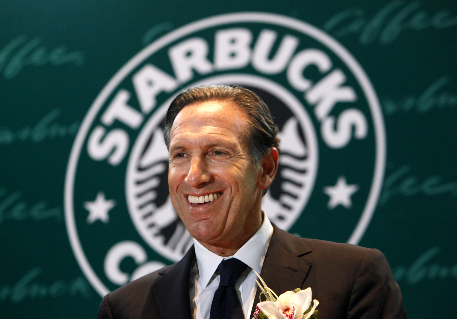 Starbucks Corp. CEO Howard Schultz smiles during a ceremony marking the 10th anniversary of the first open Starbucks coffee shop in Hong Kong Thursday, April 15, 2010. (AP Photo/Kin Cheung)