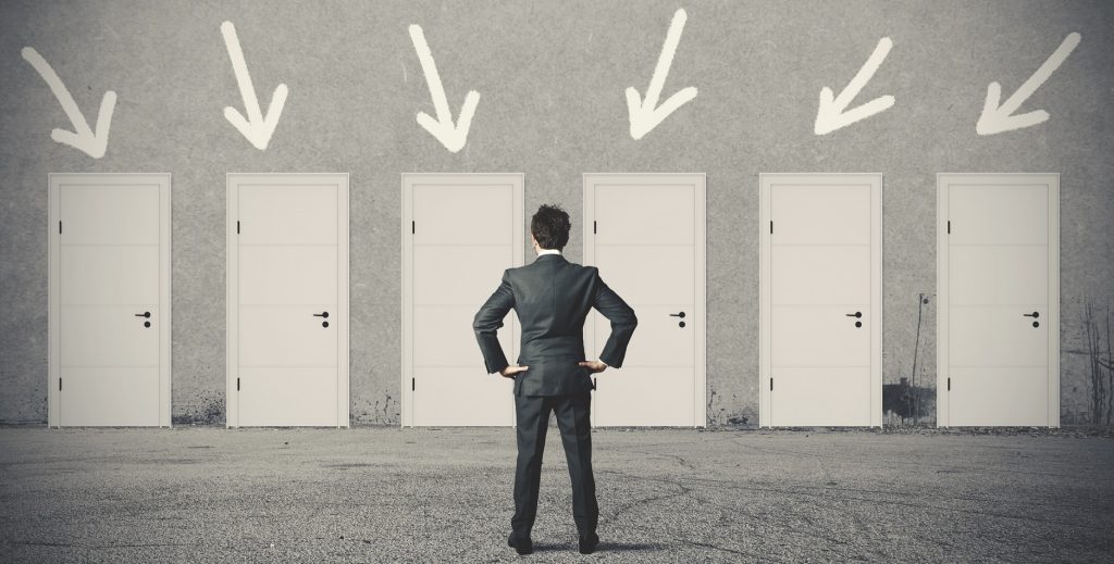 Concept of businessman choosing the right door