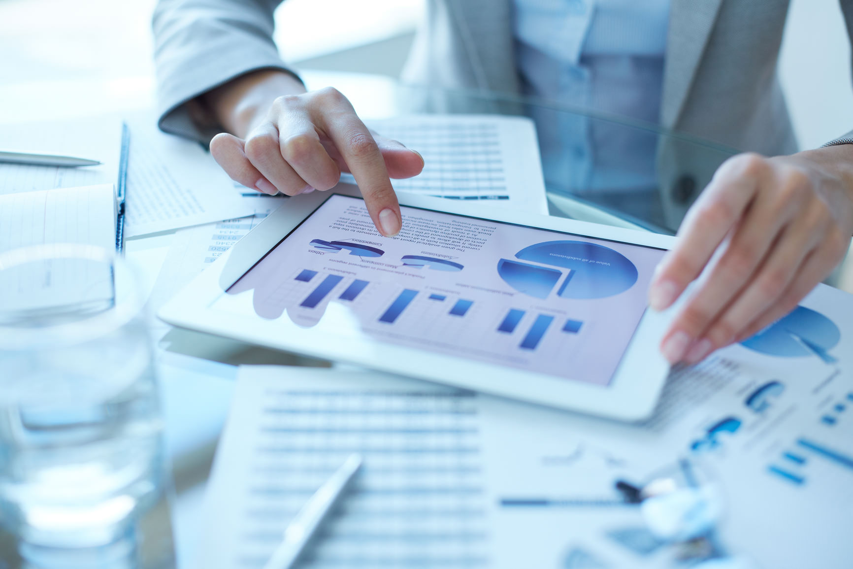 Hands of businesswoman working with electronic document in touchpad