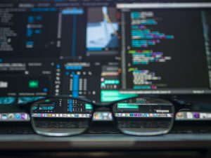 Canva - Black Farmed Eyeglasses in Front of Laptop Computer